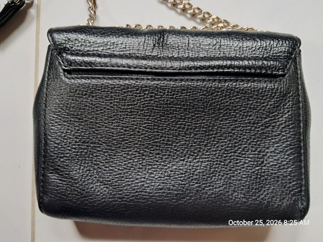 Kate Spade Briar Lane Original (Category: Cross-body Bags) located in Naga. Submitted by forsaleitems2 (Listing ID 1470144781, Image 2). Description: - Brand: Kate Spade New York - Material: Premium black pebbled leather - Closure: Flap with secure magnetic snap - Strap: Elegant chain strap included - Interior: Black monogram fabric lining with leather logo patch - Tags: Includes original fabric care tag and style tag (S338) - Condition: Excellen