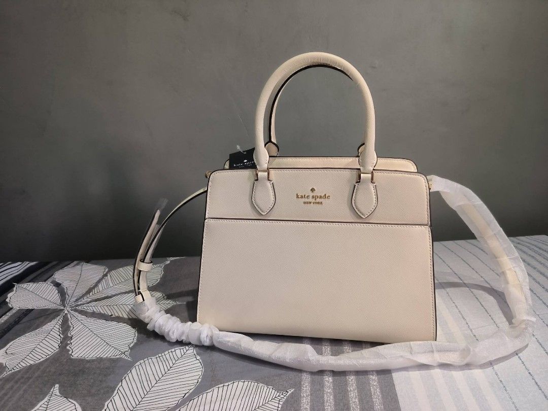 Kate Spade Madison Satchel (Category: Shoulder Bags) located in Manila. Submitted by castamayan87145 (Listing ID 1470276272, Image 3). Description: FOR SALE BRAND NEW ONHAND LOCATION NORTH FAIRVIEW ORIGINAL From US Madison Medium Satchel Bag Measurements Height: 9" Width: 5.50" 11.8" L at bottom Materials Saffiano Leather Two way script logo lining Handle Handle drop: 4.75" Strap Strap drop: 22" Features Exterior front slip pocket Interior back s