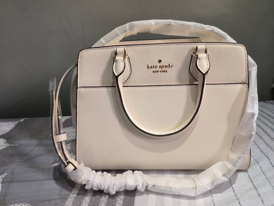 Kate Spade Madison Satchel (Category: Shoulder Bags) located in Manila. Submitted by castamayan87145 (Listing ID 1470276272, Image 1). Description: FOR SALE BRAND NEW ONHAND LOCATION NORTH FAIRVIEW ORIGINAL From US Madison Medium Satchel Bag Measurements Height: 9" Width: 5.50" 11.8" L at bottom Materials Saffiano Leather Two way script logo lining Handle Handle drop: 4.75" Strap Strap drop: 22" Features Exterior front slip pocket Interior back s