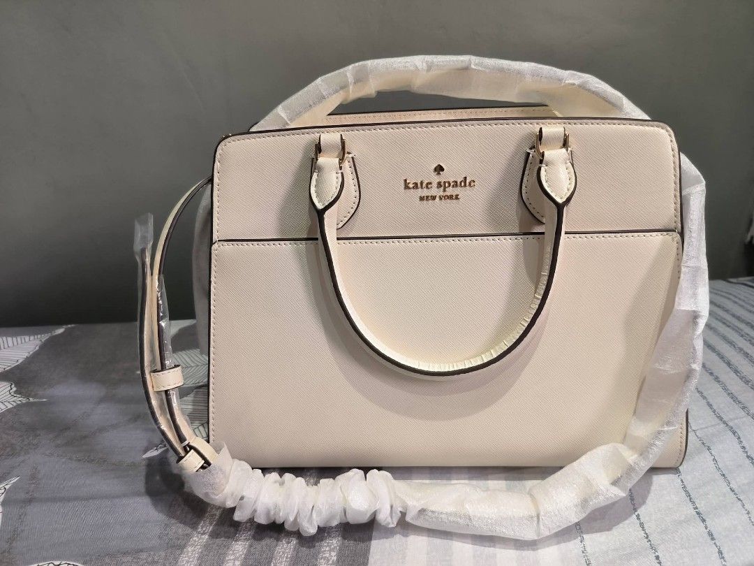 Kate Spade Madison Satchel (Category: Shoulder Bags) located in Manila. Submitted by castamayan87145 (Listing ID 1470276272, Image 2). Description: FOR SALE BRAND NEW ONHAND LOCATION NORTH FAIRVIEW ORIGINAL From US Madison Medium Satchel Bag Measurements Height: 9" Width: 5.50" 11.8" L at bottom Materials Saffiano Leather Two way script logo lining Handle Handle drop: 4.75" Strap Strap drop: 22" Features Exterior front slip pocket Interior back s