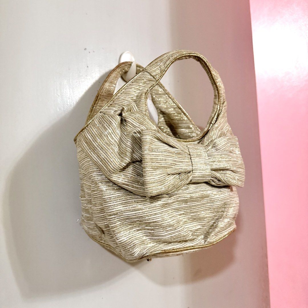 Kate Spade Ribbon Bag (Category: Luxury Bags & Wallets) located in Cavite. Submitted by digi.bratz (Listing ID 1470211929, Image 2). Description: • Great overall condition • Well-maintained • Clean interior • Unique design that stands out • Perfect for everyday use or collection .