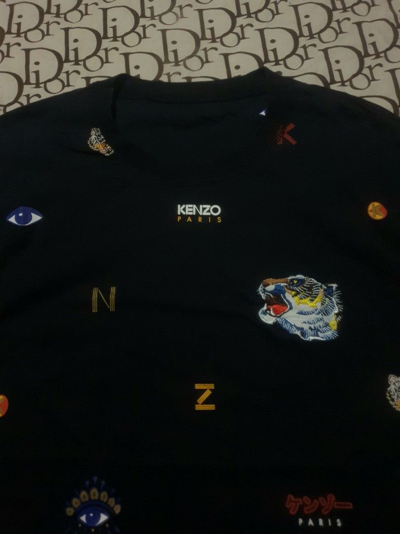 Kenzo AOP tshirt crop top (Category: Shirts) located in San Fernando. Submitted by retro.district. (Listing ID 1470345272, Image 2). Description: - Kenzo AOP top - Size: Medium(19x26) - Condition: Excellent - Issue: missing tags - Color Rate: 9.5/10.