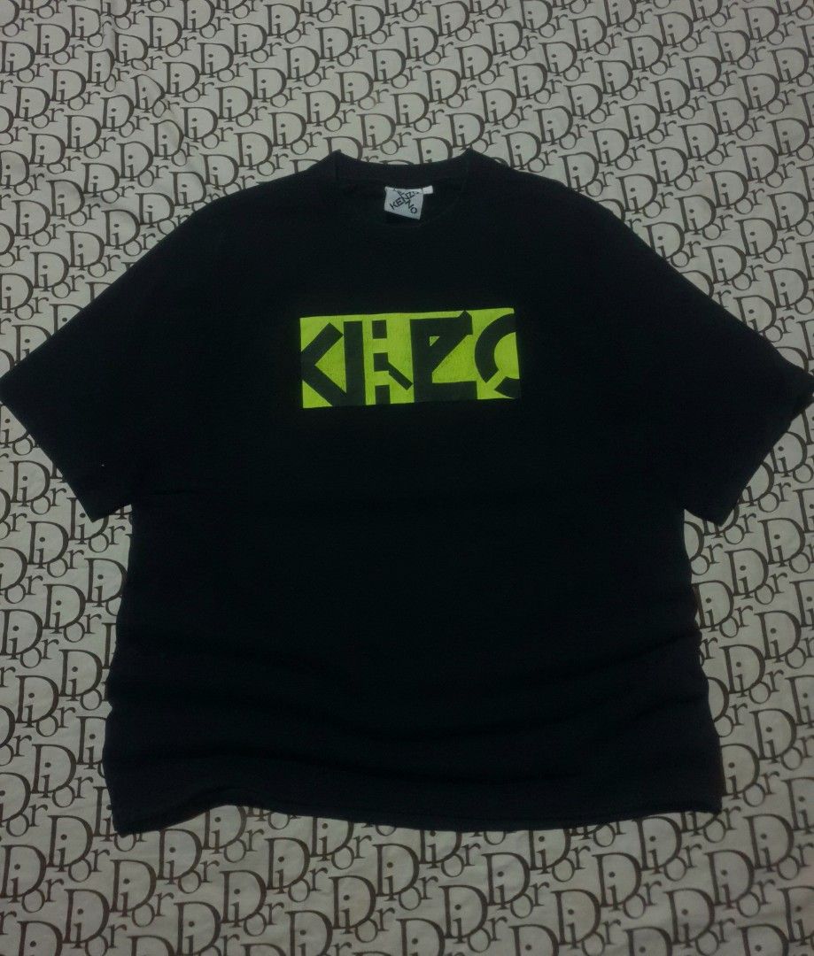 Kenzo Center logo tshirt (Category: Tshirts & Polo Shirts ) located in San Fernando. Submitted by retro.district. (Listing ID 1470345146, Image 1). Description: - Kenzo center logo tshirt - Size: XL(23x28) - Condition: Excellent - Issue: hairlines - Color Rate: 9.5/10.