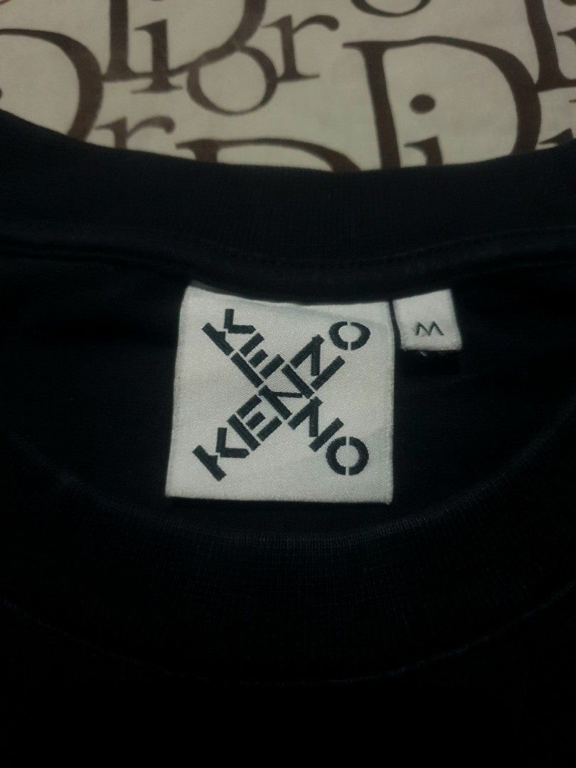 Kenzo Center logo tshirt (Category: Tshirts & Polo Shirts ) located in San Fernando. Submitted by retro.district. (Listing ID 1470345146, Image 3). Description: - Kenzo center logo tshirt - Size: XL(23x28) - Condition: Excellent - Issue: hairlines - Color Rate: 9.5/10.