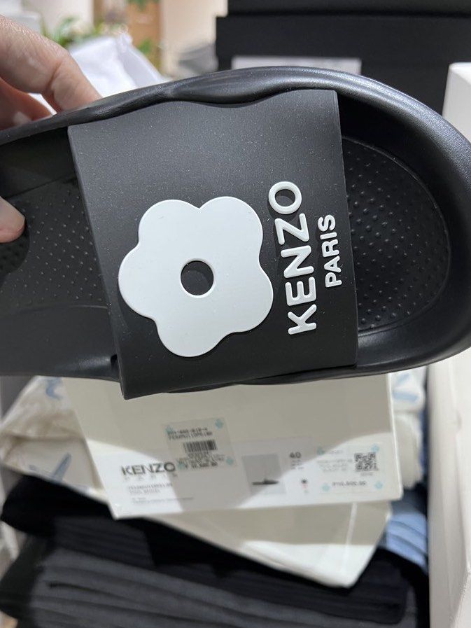 Kenzo Paris Flower Pool Slides Black Size 40 (Category: Slippers and slides) located in Muntinlupa City. Submitted by jyrys (Listing ID 1470261545, Image 1). Description: - Brand new in box, never worn - Color: Black with big white flower detail on the strap - Features a super comfy molded footbed for all-day wear - Comes with its original box with store price tag still attached - 50% off retail price - Rfs: wrong size.