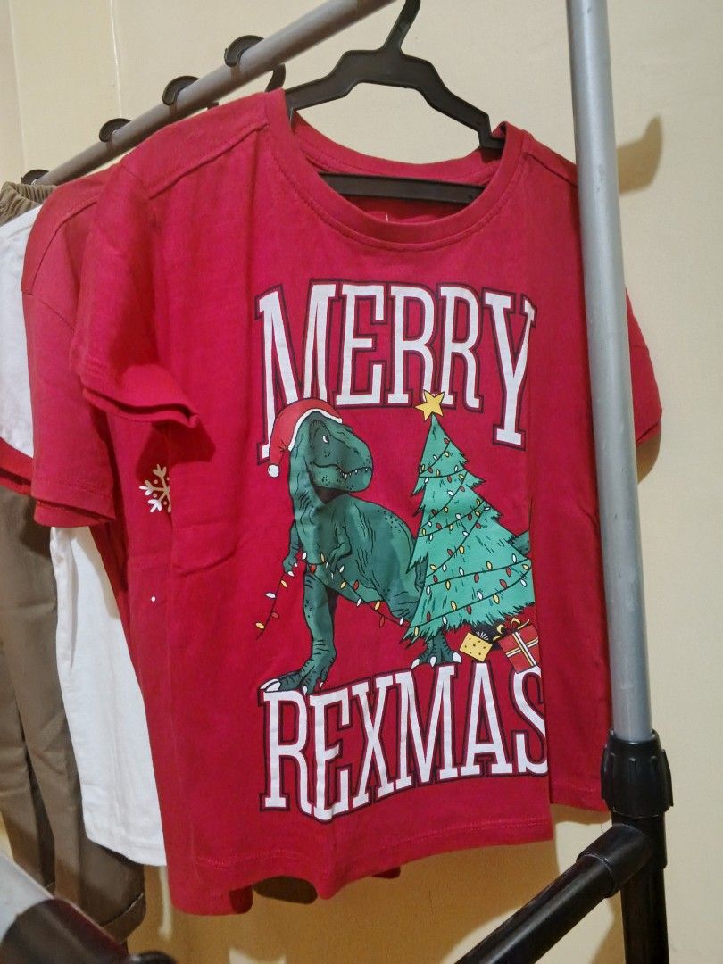 Kids Bundle Mossimo Shirt Christmas Tees Pants (Category: Babies & Kids Fashion) located in Lapu Lapu. Submitted by dawatkrist14304 (Listing ID 1470297020, Image 2). Description: - 5-piece kids' clothing bundle - 1x White Mossimo New York ringer tee - 2x Red holiday shirts with festive Christmas graphics - 2× Brown trousers with a comfortable elastic waistband - Condition: Clean fabrics, neatly stored on hangers - Perfect mix for everyday casual 