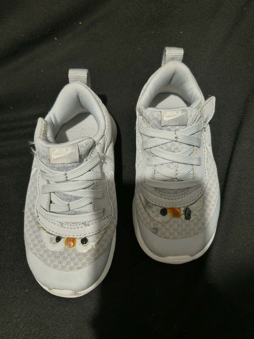 Kids Nike Grey Sneakers (Category: Babies & Kids Fashion) located in Manila. Submitted by kiyanna.preloved (Listing ID 1470252203, Image 1). Description: - Brand: Nike kids sneakers - Color: Grey with white rubber soles - Fastening: Elastic laces and convenient velcro strap - Design: Cute embroidered bird/chick detail on the toe - Features: Fabric pull tab at the back for easy wearing - Size: 15cm - Condition: Light wear underneath soles; previou