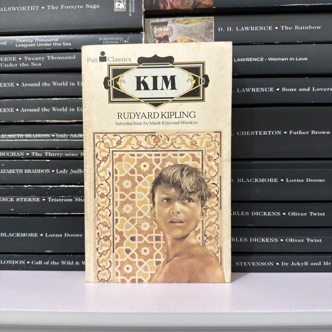 Kim by Rudyard Kipling Pan Classics Edition (Category: Storybooks) located in Lingayen. Submitted by readwjane (Listing ID 1470153057, Image 1). Description: - Title: Kim by Rudyard Kipling (Pan Classics Paperback) - Features an exclusive introduction by Mark Kincead-Weekes - Cover art showcases traditional geometric patterns with a portrait illustration - Classic adventure novel set in British India - Standard paperback format with a clean layou