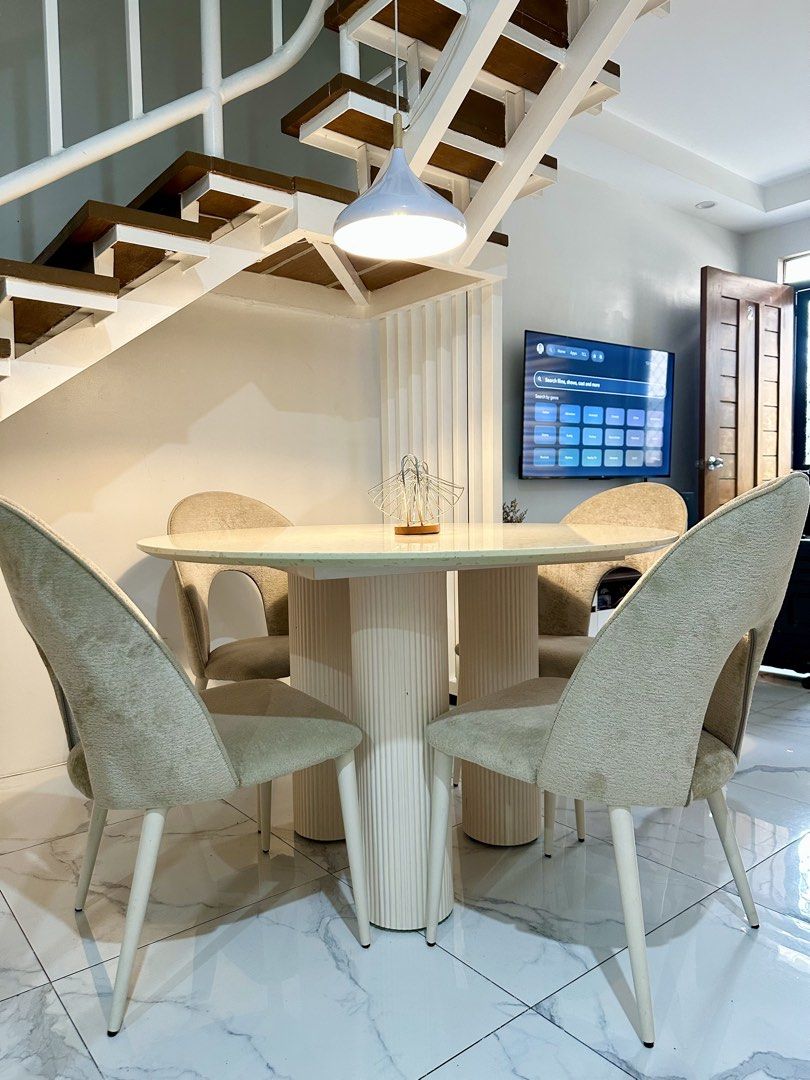 Kinsley 4-Seater Round Dining Set (Category: Tables & Sets) located in Rizal. Submitted by shopwithdikyu (Listing ID 1470175345, Image 3). Description: Kinsley 4-Seater Round Dining Set Pre-loved dining set from Mandaue Foam, perfect for a modern and minimalist home. • 1 round dining table with fluted base • 4 beige upholstered dining chairs • Original price: ₱41,850 • Selling price: ₱33,000 • Condition: Well used 📍 Location: Town & Country Exec