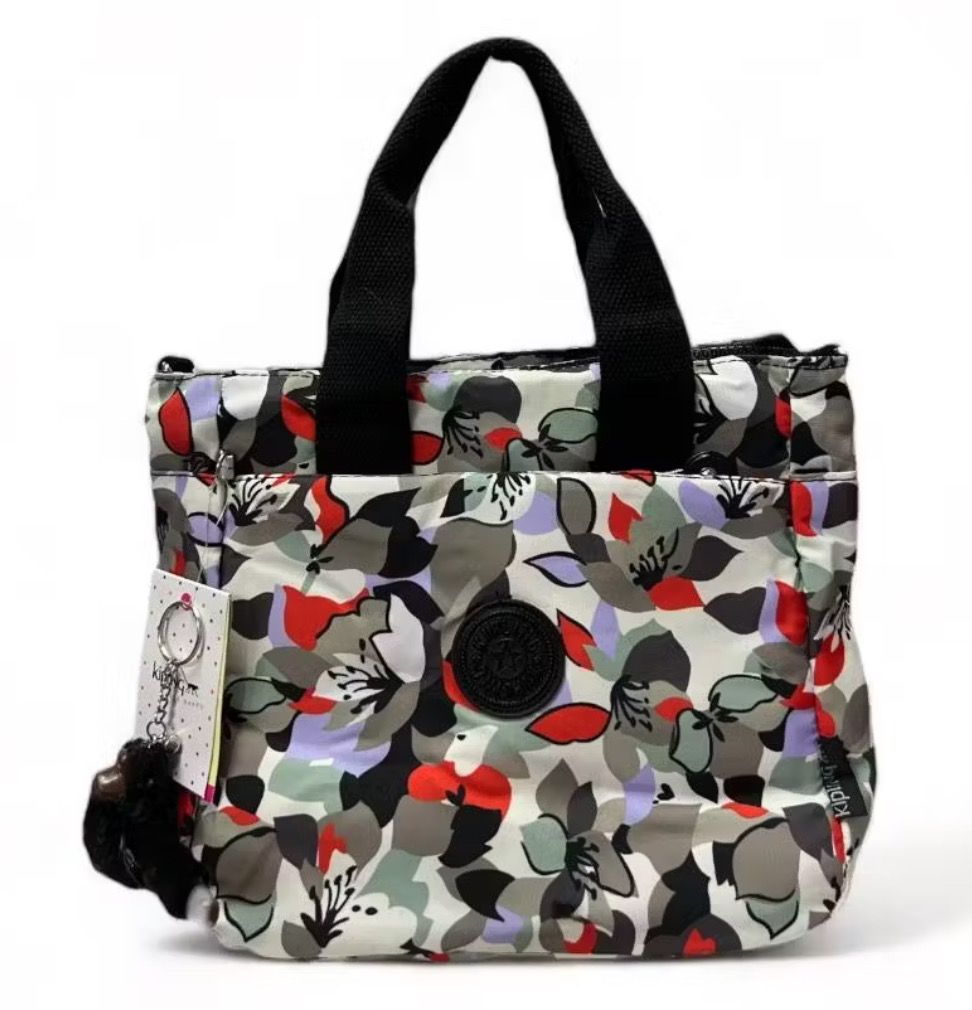 Kipling Floral Print Tote Bag Shoulder Bag (Category: Shoulder Bags) located in Bulacan. Submitted by tytoluxe (Listing ID 1470247469, Image 1). Description: Minimum purchase of 2 off per order - Brand: Kipling floral print tote bag - Design: Multi-color pattern featuring reds, greens, and greys on a light background - Features: Secure zipper top closure, convenient exterior front pocket, and durable dual black top handles - Includes: Iconic matc