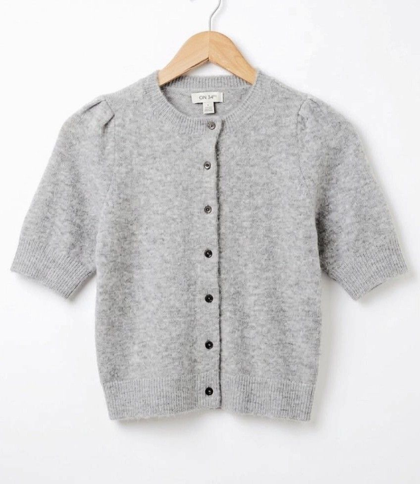 Knitted fur Cotton Full Buttons Tops (Category: Blouses) located in Quezon City. Submitted by panapton.ph (Listing ID 1470277471, Image 2). Description: -FLASH SALE ONLY 300 -Brand: ON 34TH -​Color: Light Heather Grey / Silver Grey -​Actual item post -Size fit 34 to 44bust -Soft, fuzzy knit fabric for maximum comfort -​Classy crew neckline -​Subtle puff / gathered shoulder sleeves for a feminine touch -​Full button-down front with dark contrast b