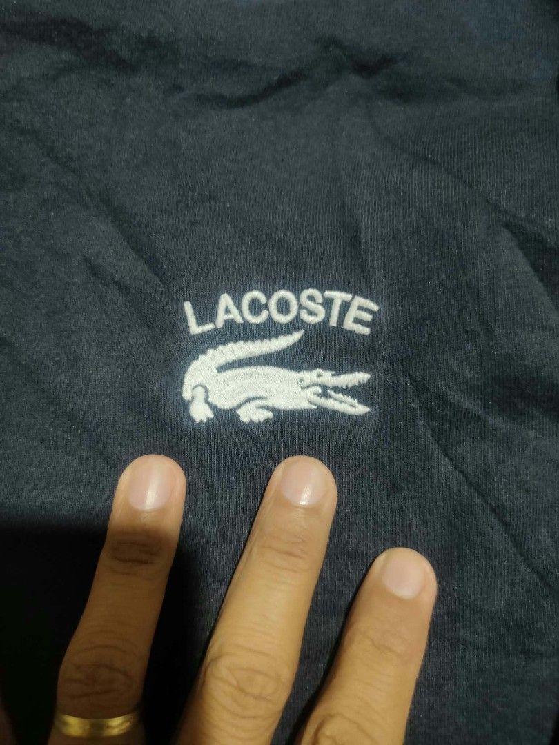 Lacoste big embroidered logo sweater (Category: Coats, Jackets and Outerwear) located in Vinzons. Submitted by kspabico07187 (Listing ID 1470285130, Image 3). Description: Excellent condition XL on tag L-28 W-22.5.