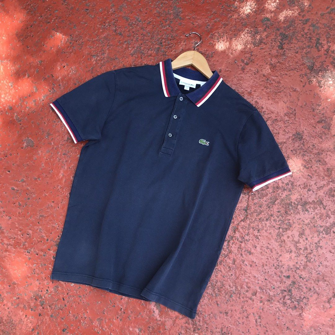 LACOSTE (Contrast-Stripe Polo Shirt) (Category: Tshirts & Polo Shirts ) located in Bulacan. Submitted by xxboutique2428 (Listing ID 1470257391, Image 1). Description: LACOSTE (Contrast-Stripe Polo Shirt) COLOR:NAVY BLUE LOGO:EMBROIDERED WAIST:20 LENGTH:26 COLOR RATE:9.5/10 CONDITION:EXCELLENT NO ISSUE .