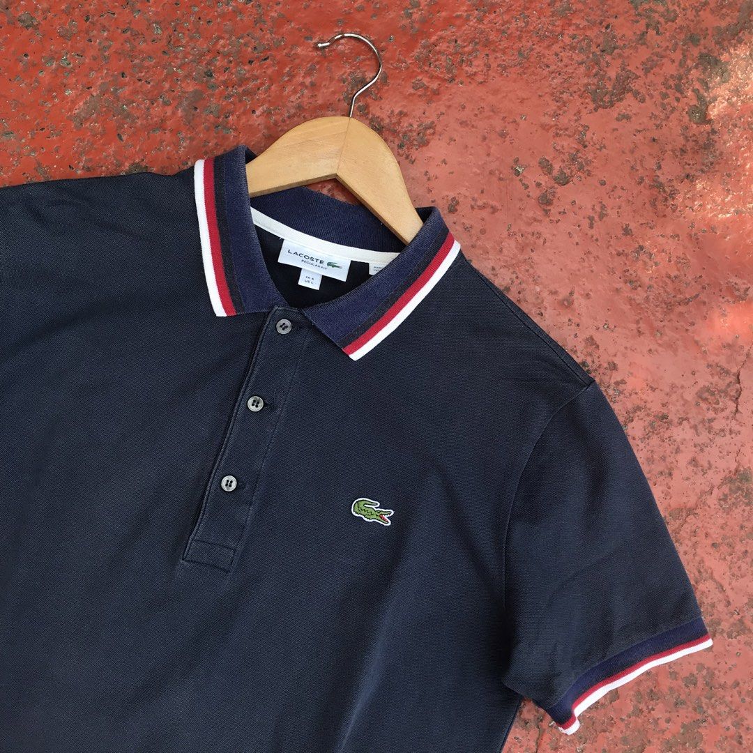 LACOSTE (Contrast-Stripe Polo Shirt) (Category: Tshirts & Polo Shirts ) located in Bulacan. Submitted by xxboutique2428 (Listing ID 1470257391, Image 2). Description: LACOSTE (Contrast-Stripe Polo Shirt) COLOR:NAVY BLUE LOGO:EMBROIDERED WAIST:20 LENGTH:26 COLOR RATE:9.5/10 CONDITION:EXCELLENT NO ISSUE .