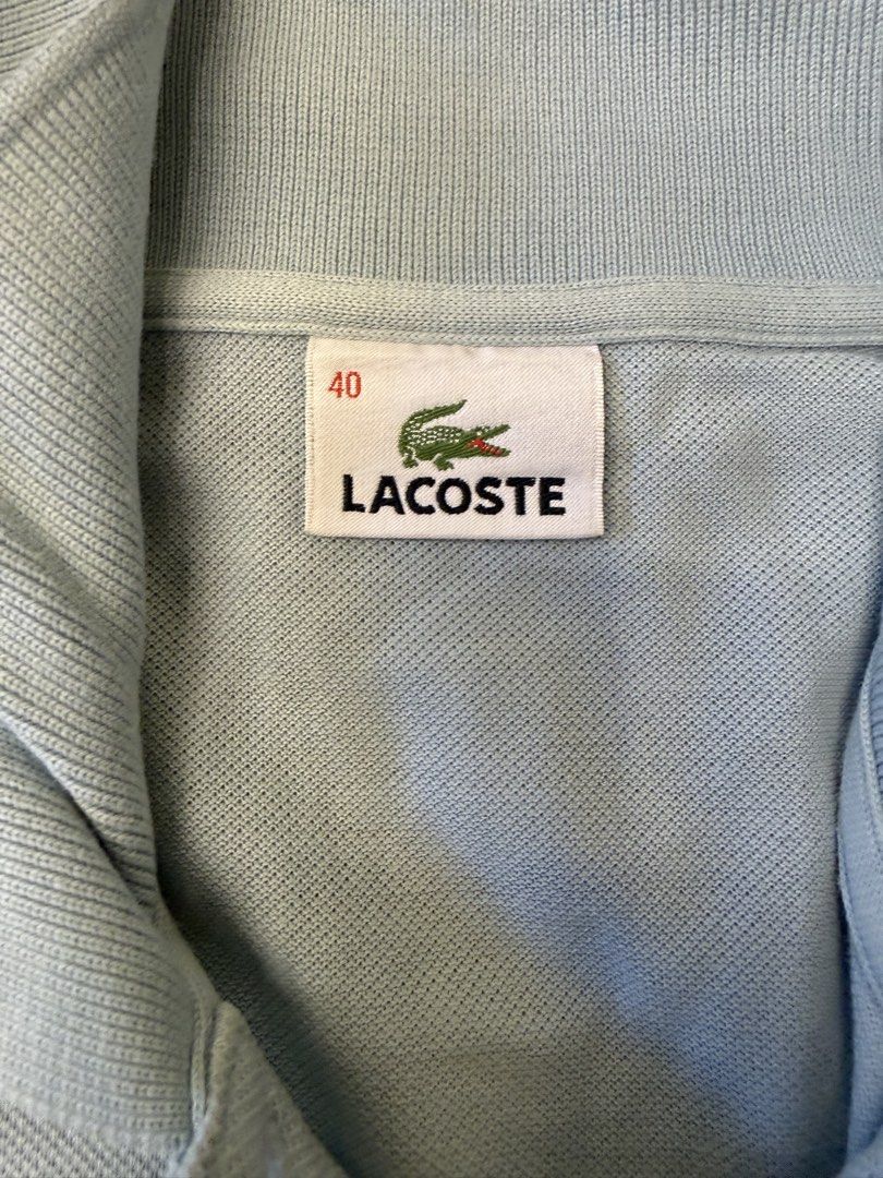 Lacoste Light Blue Polo Shirt Size 40 (Category: Shirts) located in Muntinlupa City. Submitted by el1b12345 (Listing ID 1470184982, Image 3). Description: - Brand: Lacoste - Color: Light Blue - Size: 40 - L - 22" - W - 17" - Material: Classic cotton pique fabric - Features: Short sleeves, collar, two-button placket, and embroidered green crocodile logo - Condition: Clean collar, neat hems, and ready to wear - mop: Gcash - mod: Lalamove/J&T - Pric