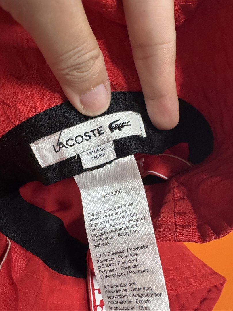 Lacoste Red Bucket Hat 👒 (Category: Babies & Kids Fashion) located in Valenzuela. Submitted by sofiasticated.decluttering (Listing ID 1470171702, Image 3). Description: - Brand: Lacoste - Style: Bucket Hat (Model RK6006) - Color: Bright Red - Size: Small - Logo: Iconic embroidered green crocodile on the side - Details: Interior branded LACOSTE red straps across the crown - Material: 100% lightweight polyester - Condition: Excellent 📌A lovely se