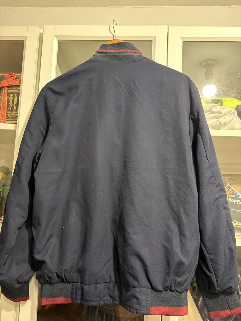 Lacoste Reversible Bomber Jacket Navy Olive Green (Category: Coats, Jackets and Outerwear) located in Quezon City. Submitted by garageband (Listing ID 1470268065, Image 3). Description: - Lacoste reversible bomber jacket - chest 22 inch, length 27 inch - Dual-color design: Navy blue on side A, olive green on side B - Classic embroidered crocodile logo on the chest - Stylish ribbed collar, cuffs, and hem with red and blue stripes - Functional side