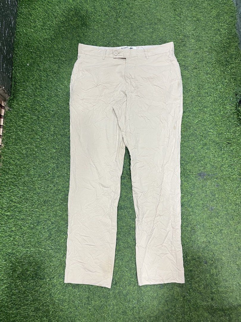 Lacoste Tapered Pants Beige US 32 (Category: Trousers) located in Balamban. Submitted by gogochrist09668 (Listing ID 1470279660, Image 1). Description: - Brand: Lacoste - Style: Tapered chino pants, style number HH7604 - Color: Classic beige - Size: French 40 / US 32 32W 36.5L - Condition: Brand new with tags attached - Details: Button closure, belt loops, and iconic embroidered crocodile logo near the pocket - Perfect for: Office wear, smart cas