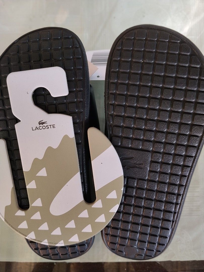 Lacoste Unisex Slide (Category: Slippers & Slides) located in General Mariano Alvarez. Submitted by iamnotjen (Listing ID 1470347386, Image 3). Description: Lacoste Serve Slide 1.0 Unisex Brand New and Authentic From Dubai plus sf Avail Size US 6,7,8,9,10,11.