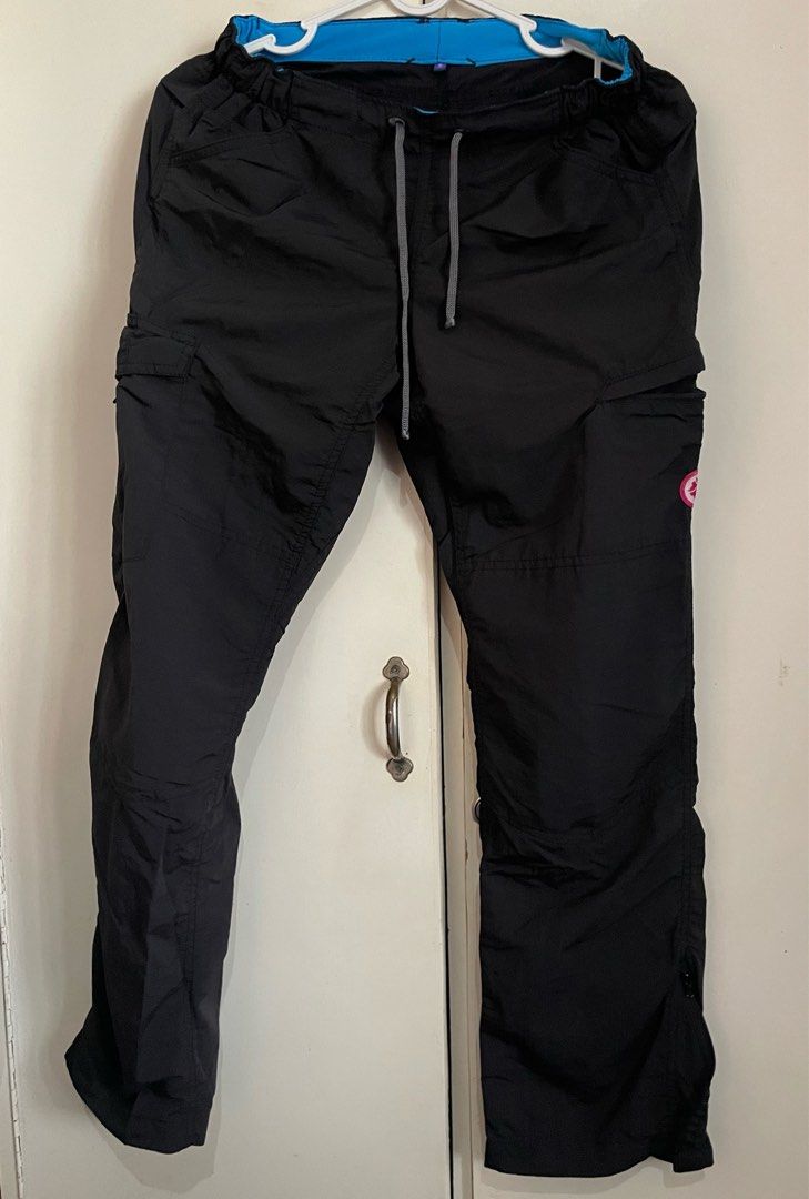 Lakambini Black Cargo Pants with Drawstring Waist (Category: Other Bottoms) located in Makati City. Submitted by nikarchives (Listing ID 1470160021, Image 1). Description: - Brand: Lakambini - Size: Small - Material: Lightweight nylon for all-day comfort - Waist: Elastic waistband with adjustable grey drawstring cords and vibrant blue inner lining - Pockets: Multiple utility pockets with secure zipper closures on the thighs - Details: Signature p