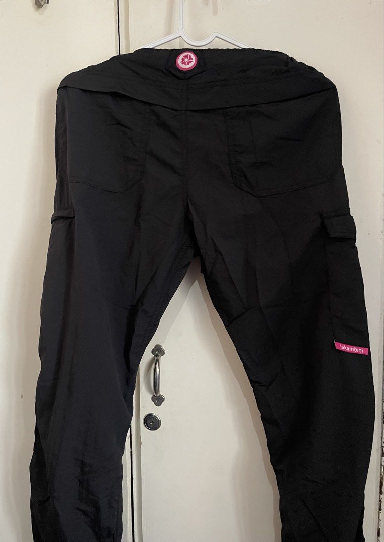 Lakambini Black Cargo Pants with Drawstring Waist (Category: Other Bottoms) located in Makati City. Submitted by nikarchives (Listing ID 1470160021, Image 2). Description: - Brand: Lakambini - Size: Small - Material: Lightweight nylon for all-day comfort - Waist: Elastic waistband with adjustable grey drawstring cords and vibrant blue inner lining - Pockets: Multiple utility pockets with secure zipper closures on the thighs - Details: Signature p