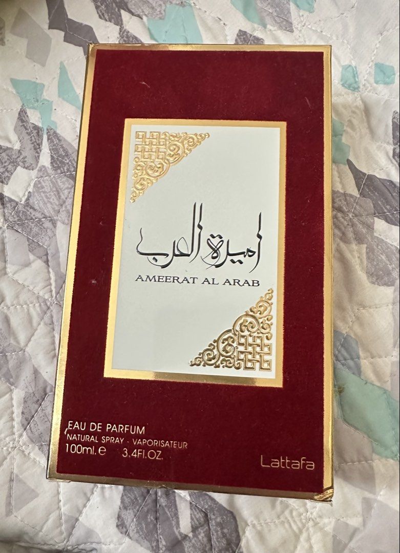 Lattafa Ameerat Al Arab Eau De Parfum 100ml (Category: Fragrance & Deodorants) located in Quezon City. Submitted by rajrajraj2022 (Listing ID 1470186003, Image 1). Description: - Brand: Lattafa - Fragrance: Ameerat Al Arab - Type: Eau de Parfum (EDP) Spray - Volume: 100ml / 3.4 fl. oz. - Packaging: Opened and sprayed once, red velvet box with gold trim and Arabic typography, original price tag is in the box. - Condition: Sprayed once, crisp corne