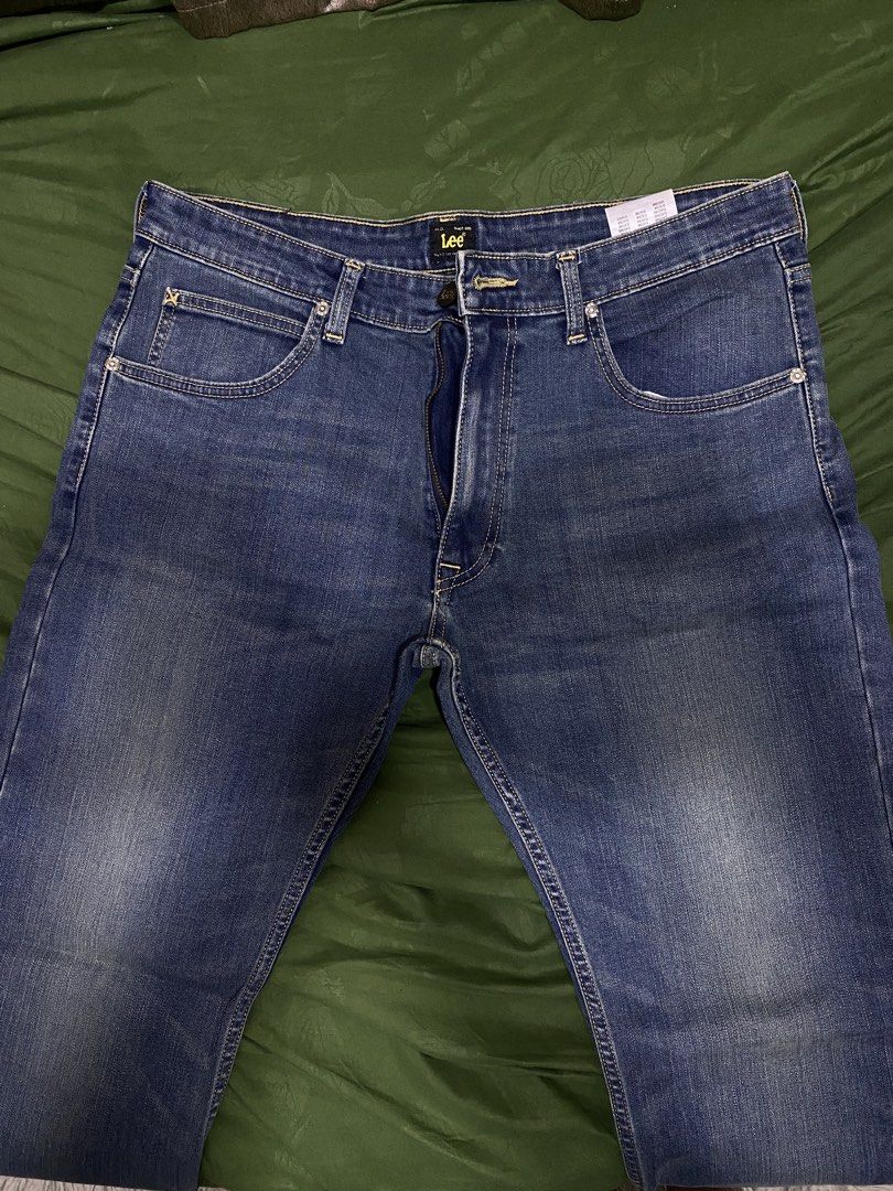 Lee Blue Denim Jeans (Category: Jeans) located in Manila. Submitted by cyyruss (Listing ID 1470150874, Image 1). Description: - Brand: Lee - Color/Wash: Blue denim with natural fading on thighs - Style: Classic five-pocket design with contrast stitching - Closure: Button fly - Condition: Brand new with tags attached - Details: Inner waistband brand label.