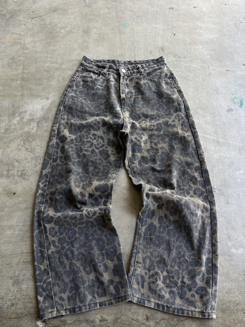 Leopard Print Wide Leg Denim Jeans (Category: Jeans) located in Dipaculao. Submitted by _jzx.ph4lxfe (Listing ID 1470214658, Image 1). Description: - Trendy wide leg jeans with an allover grey leopard print - Relaxed fit for all-day comfort - Classic button closure, zip fly, and functional front/back pockets - Clean denim wash with a blank leather patch at the back - Perfect statement piece for casual everyday outfits.