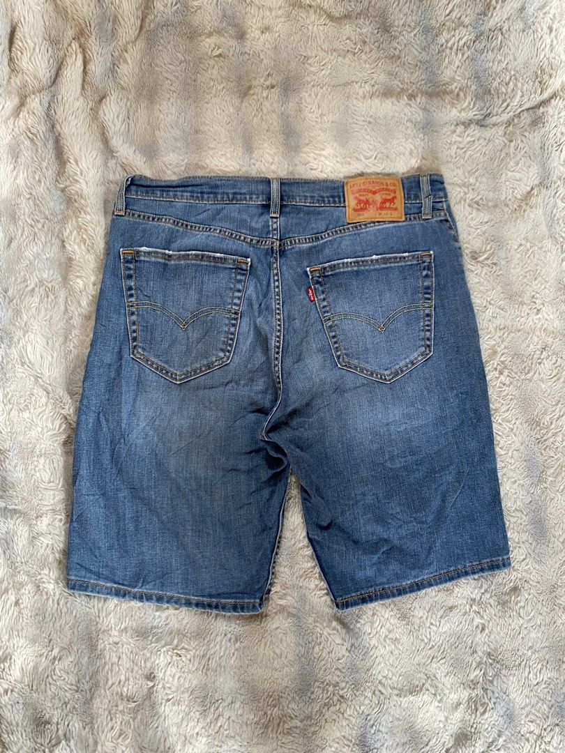 Levi's 505 Denim Shorts W34 (Category: Shorts) located in Andop. Submitted by safewater-895a (Listing ID 1470280255, Image 1). Description: - Brand: Levi's 505 Denim Shorts - Size: W34 - Color/Wash: Medium blue with subtle thigh fading - Details: Classic 5-pocket style, button fly, copper rivets, and leather back patch - Condition: Sturdy denim with cool distressed edges on the back pockets - All details are posted - Waistline: 34-36 - Lenght: 21