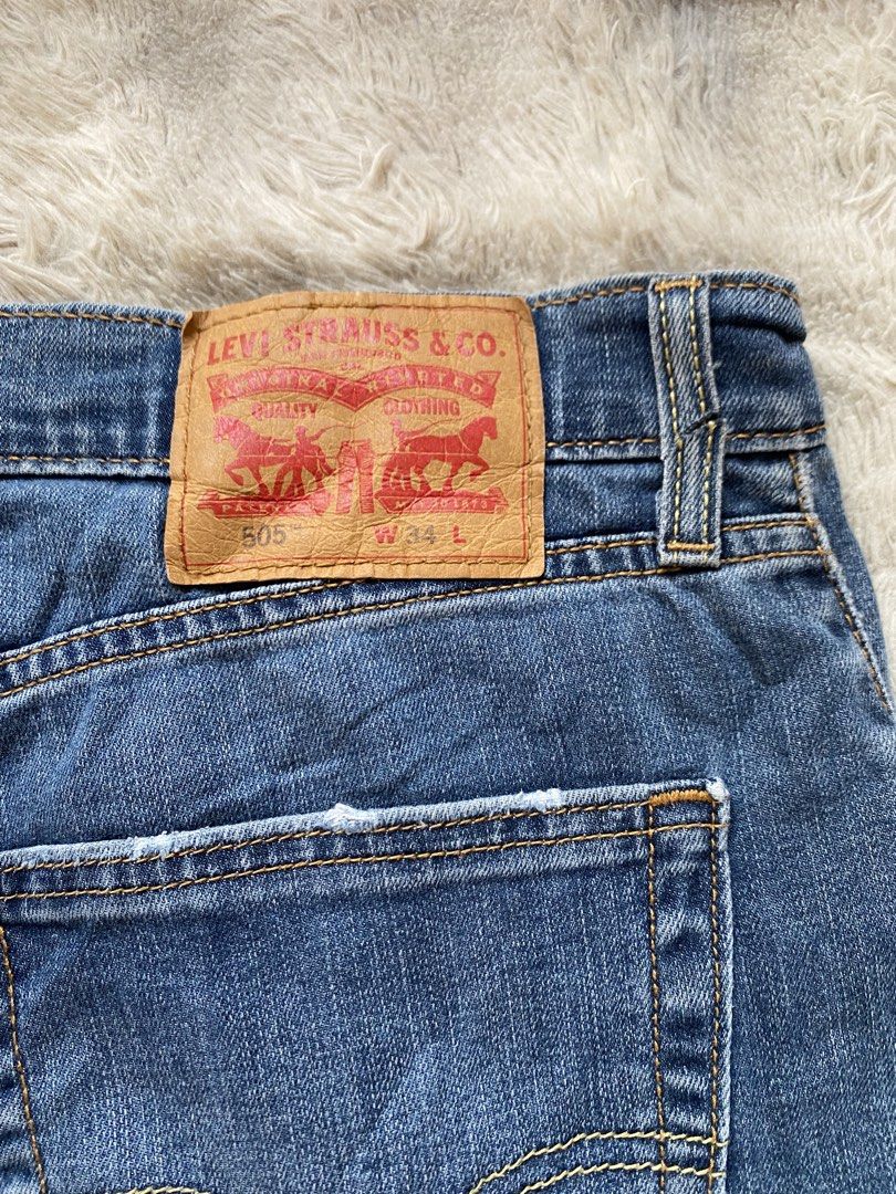 Levi's 505 Denim Shorts W34 (Category: Shorts) located in Andop. Submitted by safewater-895a (Listing ID 1470280255, Image 3). Description: - Brand: Levi's 505 Denim Shorts - Size: W34 - Color/Wash: Medium blue with subtle thigh fading - Details: Classic 5-pocket style, button fly, copper rivets, and leather back patch - Condition: Sturdy denim with cool distressed edges on the back pockets - All details are posted - Waistline: 34-36 - Lenght: 21
