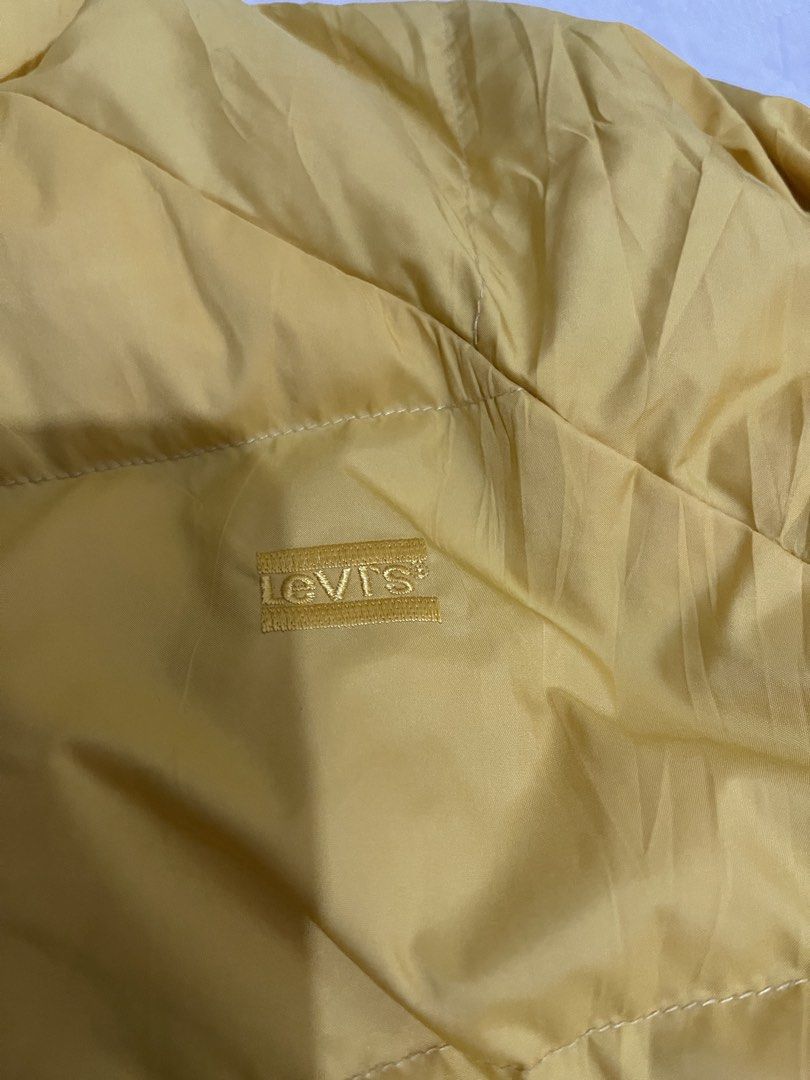 Levi's Reversible Puffer Jacket Yellow Leopard Print Size S (Category: Coats, Jackets and Outerwear) located in Caloocan City. Submitted by noblecat_c04f74 (Listing ID 1470156090, Image 2). Description: - Brand: Levi's - Style: Reversible puffer jacket - Size: Small - Side A: Solid yellow - Side B: Leopard print body with black sleeves - Features: Stand-up collar, front zip closure, elasticated cuffs and hem - Condition: Great find, highly versat