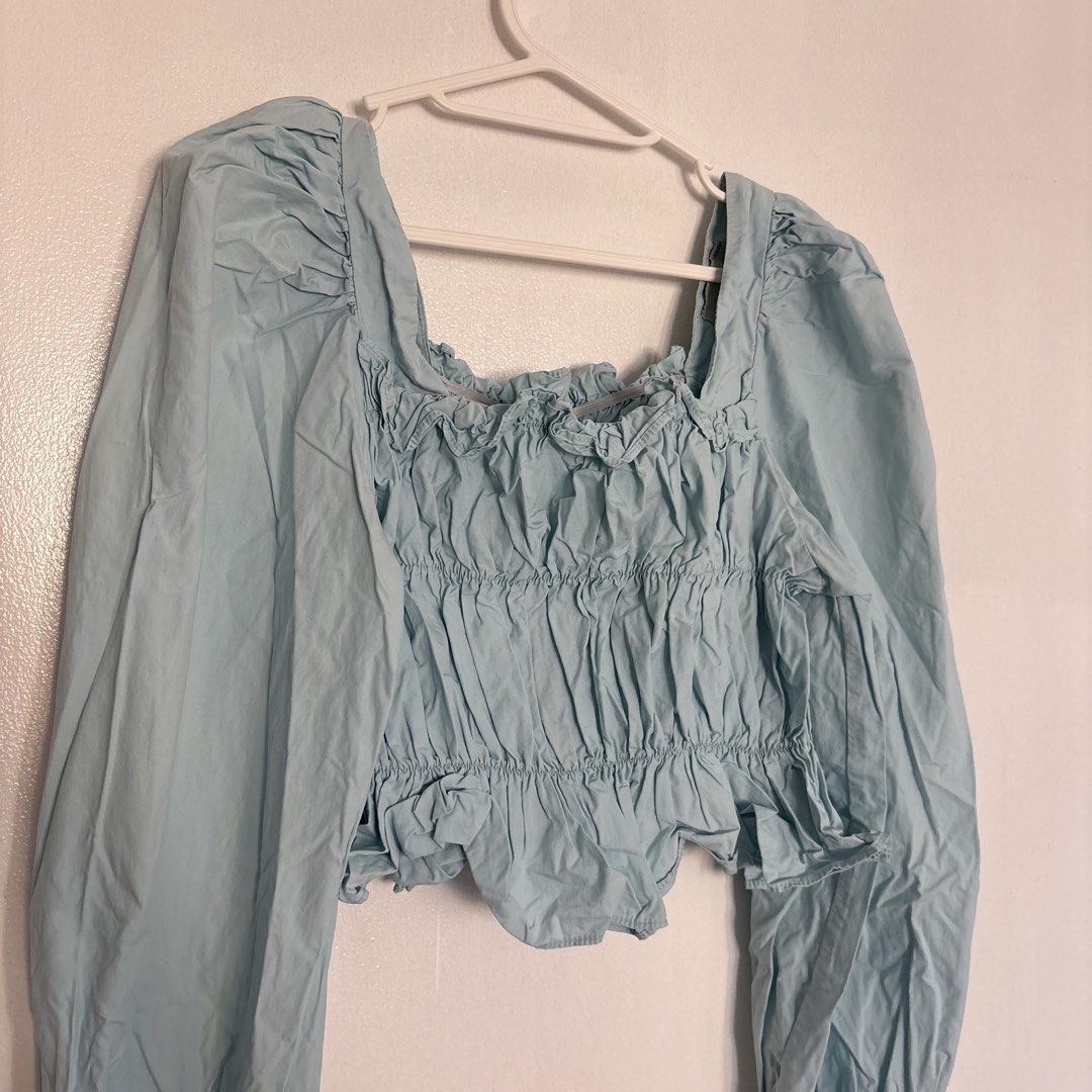 Light blue square neck crop top with puff sleeves (Category: Blouses) located in Pasig City. Submitted by _jinwifeu_ (Listing ID 1470222441, Image 3). Description: 📏 fits small to medium 📍 ortigas, pasig 💸 maribank,bdo, gcash, maya 🚚 same day delivery (lalamove, grab etc).