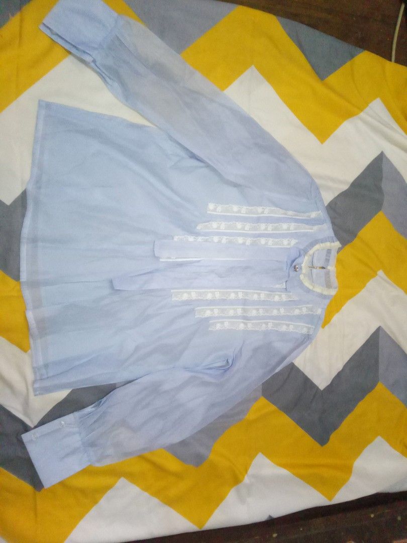 LIGHT BLUE VINTAGE LACE BLOUSE 🩵 (Category: Longsleeves) located in Manila. Submitted by fabelz (Listing ID 1470180130, Image 1). Description: 🩵 LIGHT BLUE VINTAGE LACE BLOUSE 🩵 💰 Price:₱200 (negotiable) ୨ৎ Details • Color: Light blue • Size: Small to Medium (S-M) • Style: Vintage-inspired blouse with delicate white lace details • Sleeves: Long sleeves with buttoned cuffs • Condition: Never worn 🩵 A pretty, vintage-inspired blouse with delic