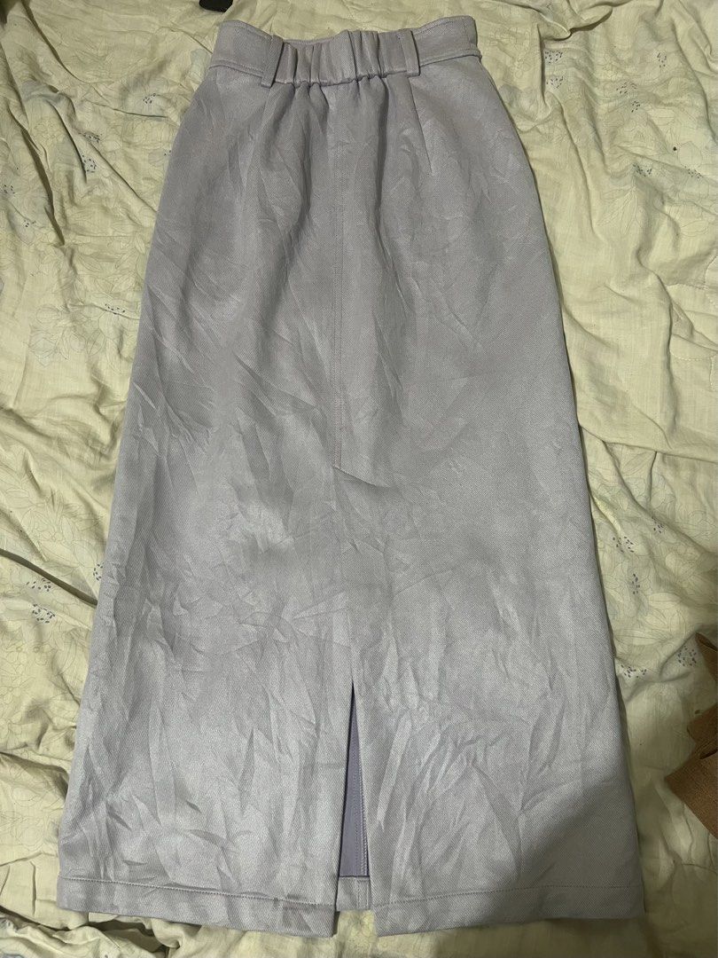 Light purple midi pencil skirt with back slit (Category: Skirts) located in San Jose del Monte. Submitted by sofiah2997 (Listing ID 1470220174, Image 2). Description: - Color: Light purple - Length: Below the knee (midi) - Waist: Clean front with belt loops and a comfortable elastic back - Design: Center split at the hem for easy movement - Fabric: Smooth and comfortable texture - Condition: Brand new / Excellent (ready to wear) -waist 25-27.