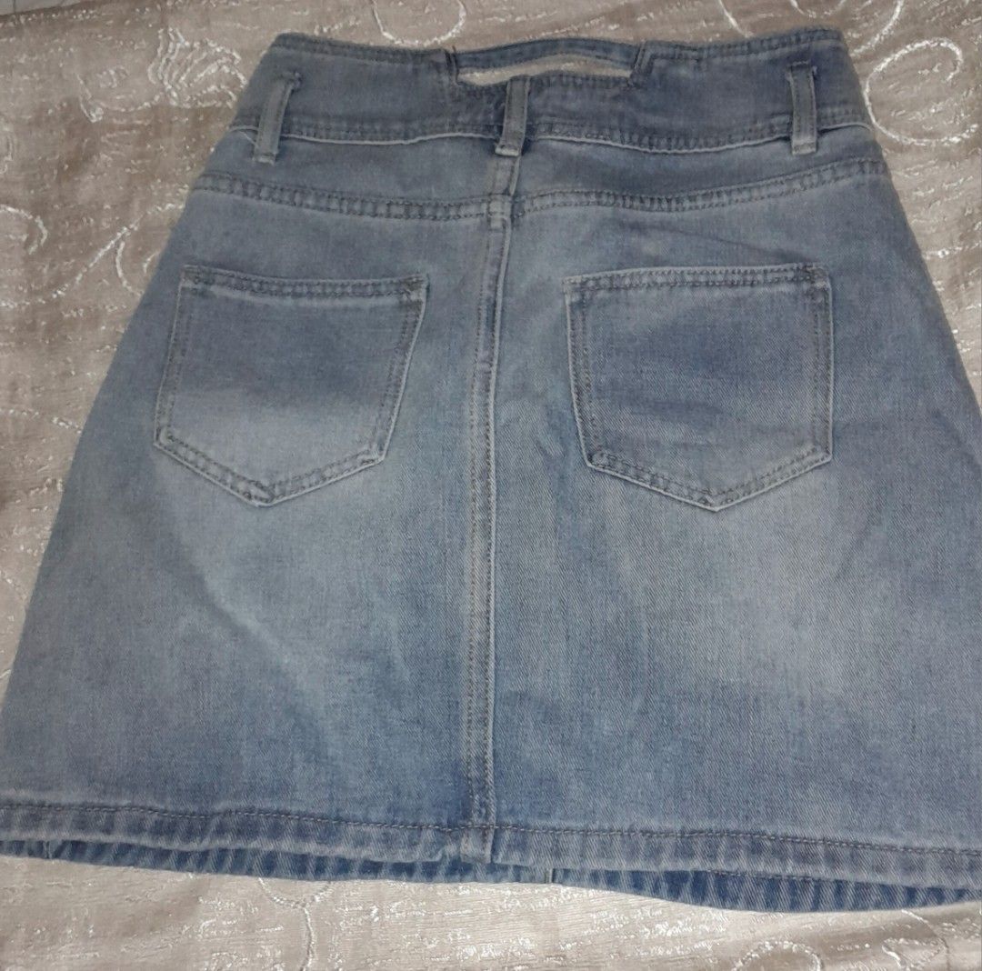 Light wash high-waisted denim skirt (Category: Skirts) located in Manila. Submitted by chasndvl (Listing ID 1470142744, Image 2). Description: - Light wash denim mini skirt - Trendy double-button waistband - Classic five-pocket design with belt loops - Structured fabric with a stylish fade pattern - Back patch pockets and yoke detailing - Easy to style with basic tees and crop tops bought from ukay from 129 di kasya Size 25inches Lenght 17inches.