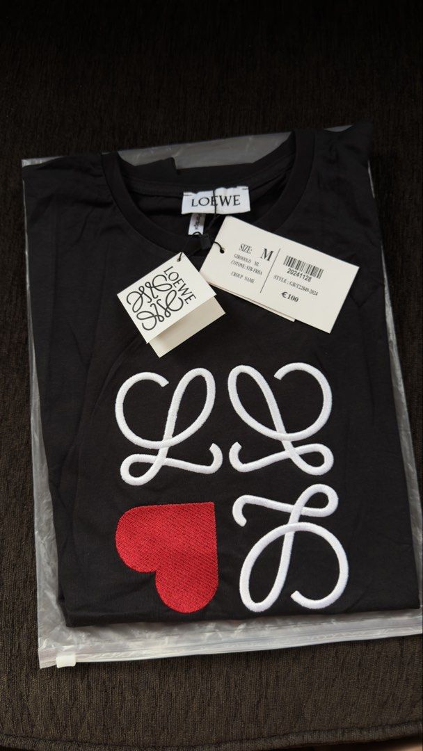 Loewe T-shirt (Category: Shirts) located in Angat. Submitted by shopmyclosetbykris (Listing ID 1470313363, Image 3). Description: LOEWE Women's cut OG quality shirts! Same tags ect. Highest quality fabric (stretchy) Limited pcs only! No more restock! Made in Portugal, not BKK With sizes, not free size Price: 880 each only Location: Baliwag Bulacan .