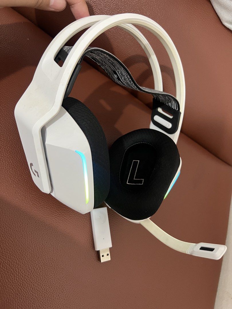 Logitech G733 Lightspeed Wireless Gaming Headset White (Category: Headphones & Headsets) located in Paombong. Submitted by declutteredbychee_ (Listing ID 1470227771, Image 3). Description: - Color/Design: Sleek white wireless gaming headset with a stylish black and white suspension headband - Lighting: Vibrant RGB lighting strips - Connectivity: Includes matching white USB receiver dongle - Audio & Mic: Flexible microphone arm for crystal-clear c