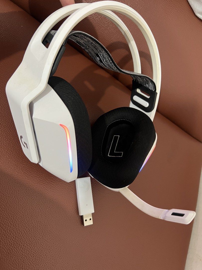 Logitech G733 Lightspeed Wireless Gaming Headset White (Category: Headphones & Headsets) located in Paombong. Submitted by declutteredbychee_ (Listing ID 1470227771, Image 1). Description: - Color/Design: Sleek white wireless gaming headset with a stylish black and white suspension headband - Lighting: Vibrant RGB lighting strips - Connectivity: Includes matching white USB receiver dongle - Audio & Mic: Flexible microphone arm for crystal-clear c