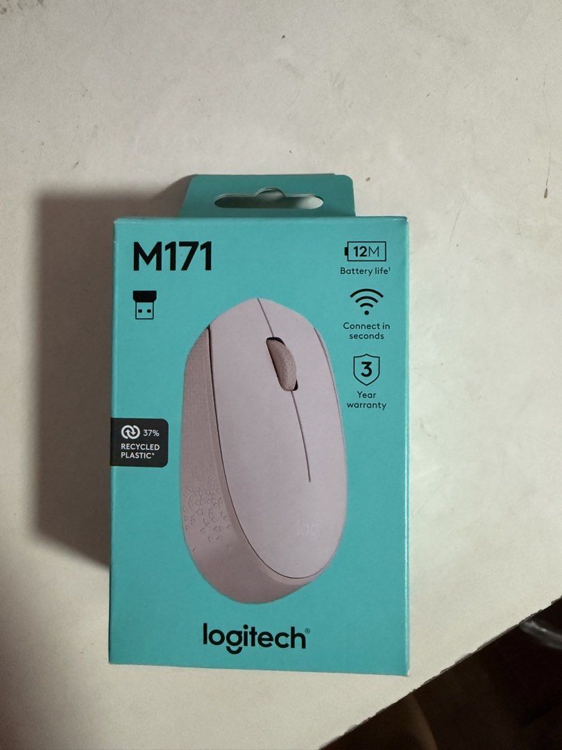 Logitech M171 Wireless Mouse Rose (Category: Mouse & Mousepads) located in Pasig City. Submitted by mollyscloset123 (Listing ID 1470200817, Image 1). Description: - Brand: Logitech M171 Wireless Mouse - Color: Rose (Aesthetic pink shade) - Condition: Brand new, opened box but never used - Wireless Range: Up to 10 meters via plug-and-play USB receiver - Battery Life: Up to 12 months on a single battery - Compatibility: Works with Windows, macOS, L