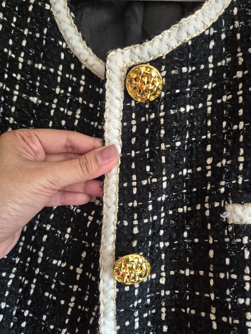 Long Black and White Tweed Jacket with Gold Buttons (Category: Coats, Jackets and Outerwear) located in Manila. Submitted by belovedbyjess (Listing ID 1470150402, Image 2). Description: - Classic black and white tweed jacket - Structured open-front design with white braided trim - Elegant gold embossed buttons on placket and decorative pockets - Fully lined in comfortable black fabric - Versatile layering piece for work or casual outings No when 