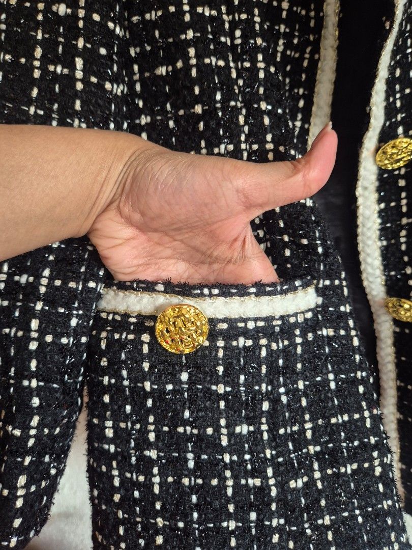 Long Black and White Tweed Jacket with Gold Buttons (Category: Coats, Jackets and Outerwear) located in Manila. Submitted by belovedbyjess (Listing ID 1470150402, Image 3). Description: - Classic black and white tweed jacket - Structured open-front design with white braided trim - Elegant gold embossed buttons on placket and decorative pockets - Fully lined in comfortable black fabric - Versatile layering piece for work or casual outings No when 