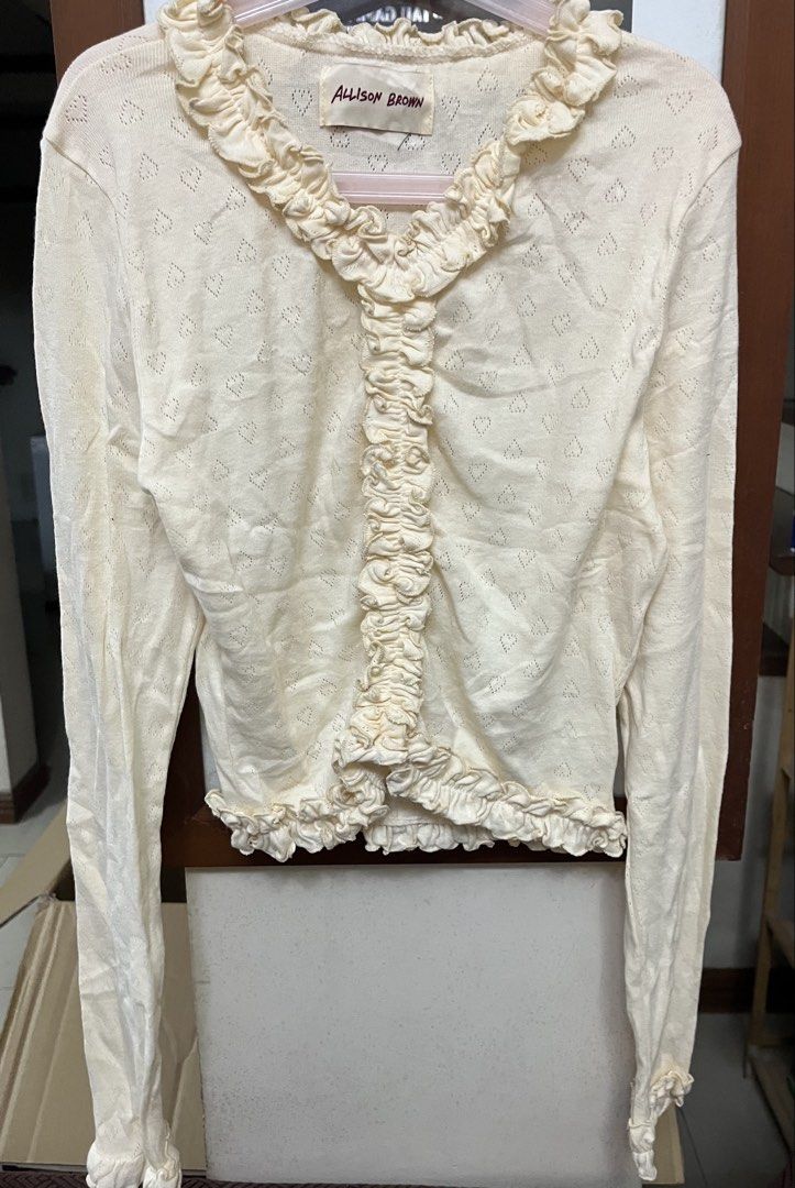 Long sleeves (Category: Longsleeves) located in Bacoor. Submitted by ayit. (Listing ID 1470268618, Image 1). Description: - orig japan sf inc Brand: Allison Brown - Size: S (EU 36 / UK 8 / US 4) - Color: Cream / Off-white - Design: Long sleeves with delicate ruffled collar, front placket, and hem - Pattern: Subtle all-over heart knit texture - Condition: Well-maintained and stylish for daily wear or OOTDs.