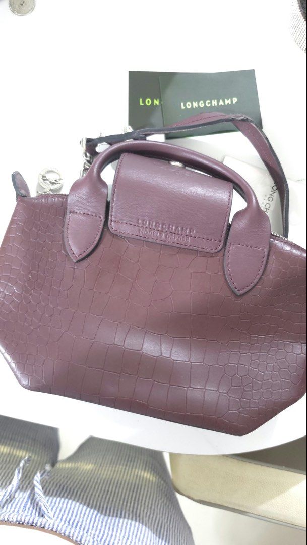 LONGCHAMP LE PLIAGE CUIR EXTRA SMALL / MINI TOP HANDLE BAG (Category: Shoulder Bags) located in Manila. Submitted by mahaechn (Listing ID 1470318746, Image 2). Description: PRELOVED LONGCHAMP LE PLIAGE CUIR EXTRA SMALL / MINI TOP HANDLE BAG 👜 * Brand: Longchamp * Model: Le Pliage Cuir Extra Small / Mini Top Handle Bag * Inclusion: Dust bag and authentication card * RFS: Decluttering * Please manage your expectations since this is a preloved item