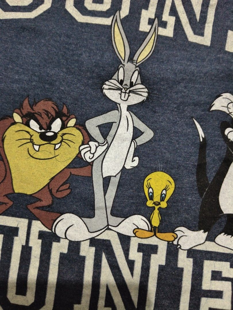 Looney Tunes Graphic Tee Heather Navy Small (Category: Tshirts & Polo Shirts ) located in Manila. Submitted by icesummer.onlineshop (Listing ID 1470156427, Image 3). Description: - Design: Looney Tunes graphic with Bugs Bunny, Tweety, and Taz in collegiate block lettering - Color: Heather dark blue - Size: S/P - Material: 60% cotton, 40% polyester - Details: short sleeves, made in Bangladesh.
