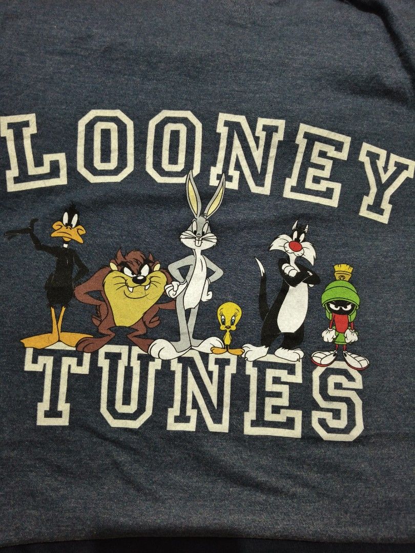 Looney Tunes Graphic Tee Heather Navy Small (Category: Tshirts & Polo Shirts ) located in Manila. Submitted by icesummer.onlineshop (Listing ID 1470156427, Image 2). Description: - Design: Looney Tunes graphic with Bugs Bunny, Tweety, and Taz in collegiate block lettering - Color: Heather dark blue - Size: S/P - Material: 60% cotton, 40% polyester - Details: short sleeves, made in Bangladesh.
