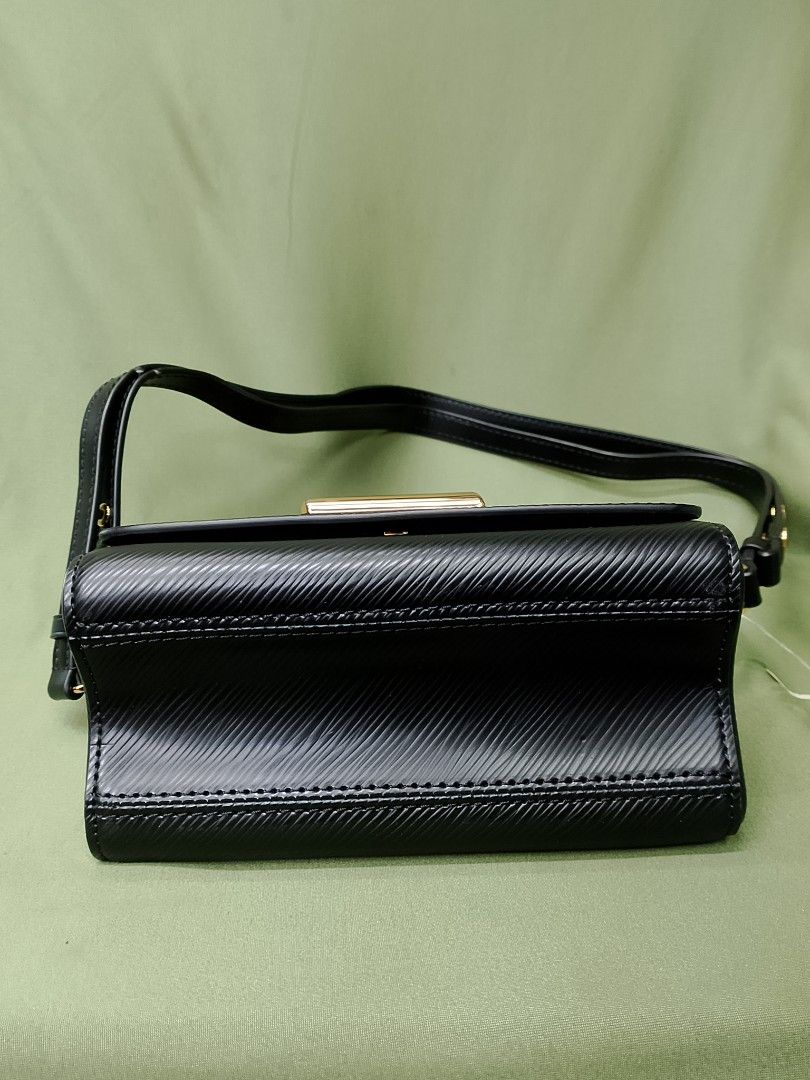 Louis Vuitton Black Epi Leather Bag with Leopard Handle (Category: Luxury Bags & Wallets) located in Baguio. Submitted by luxuryitems08 (Listing ID 1470143497, Image 3). Description: - Material: Black Epi leather with black interior lining and slip pocket - Hardware: Gold-tone LV twist lock closure - Distinctive Details: Includes a stylish leopard print top handle and matching luggage tag - Straps: Comes with a removable black leather shoulder st
