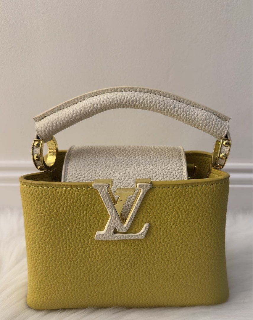 Louis Vuitton Capucines Mini Yellow White Leather Handbag (Category: Luxury Bags & Wallets) located in Manila. Submitted by audreyhepburn21 (Listing ID 1470317995, Image 1). Description: - Authentic Louis Vuitton Capucines Mini - Eye-catching bright yellow and white grained leather - Elegant gold-tone hardware and structured shape - Iconic LV logo front flap closure - Compact size ideal for daily essentials - Condition: Excellent / Gently used (r