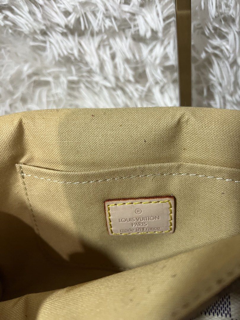 Louis Vuitton Damier Azur Canvas Shoulder Bag (Category: Luxury Bags & Wallets) located in San Carlos. Submitted by jessamaep_deer (Listing ID 1470271677, Image 3). Description: - Authentic Louis Vuitton shoulder bag - Iconic Damier Azur canvas in white and blue-grey - Elegant gold-tone hardware on the front flap and chain strap - Premium tan leather trim with an adjustable strap included - Fabric interior lining equipped with a convenient slip p