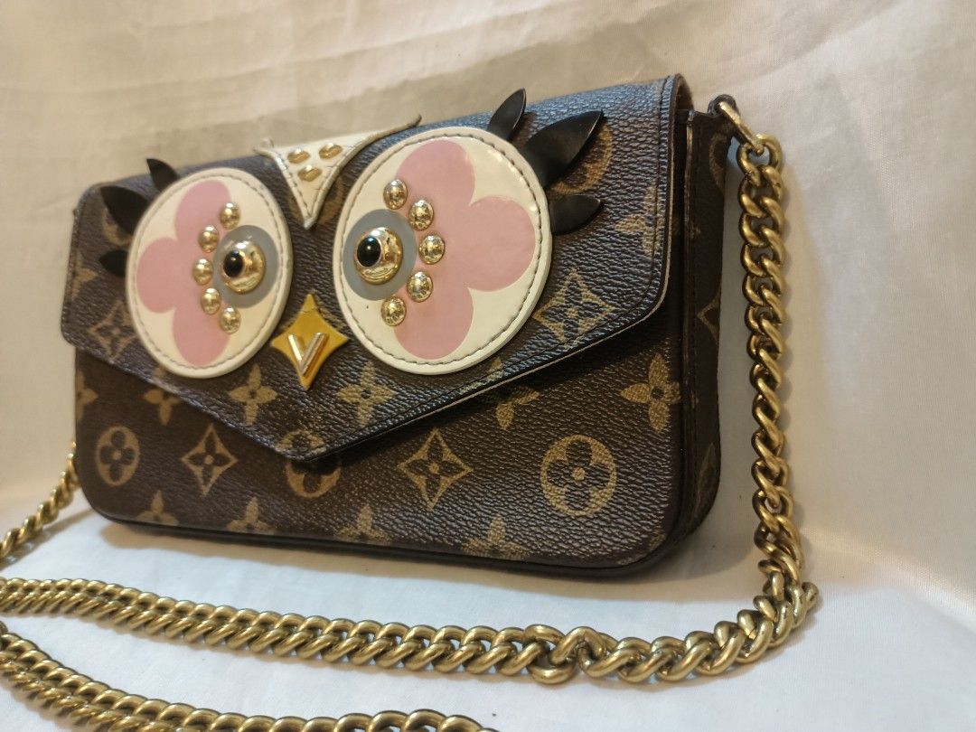 Louis Vuitton Monogram Canvas Owl Crossbody Bag (Category: Luxury Bags & Wallets) located in Manila. Submitted by preloved439 (Listing ID 1466391102, Image 3). Description: - Louis Vuitton monogram canvas crossbody bag - Eye-catching owl face design with pink/white leather appliques, studs, and black feather details - Chic chunky gold-tone chain strap - Secure magnetic snap closure - Compact size, perfect for daily essentials - Minimal flaws (see