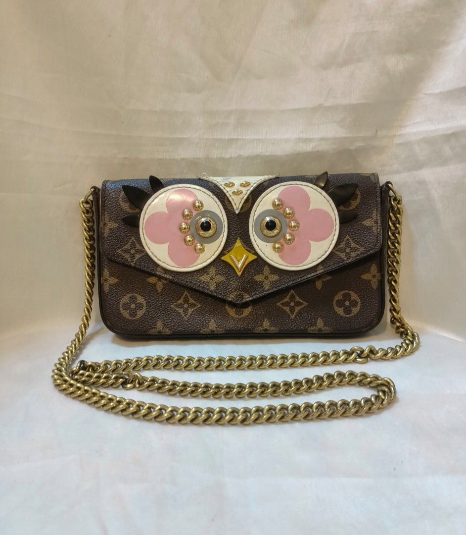 Louis Vuitton Monogram Canvas Owl Crossbody Bag (Category: Luxury Bags & Wallets) located in Manila. Submitted by preloved439 (Listing ID 1466391102, Image 1). Description: - Louis Vuitton monogram canvas crossbody bag - Eye-catching owl face design with pink/white leather appliques, studs, and black feather details - Chic chunky gold-tone chain strap - Secure magnetic snap closure - Compact size, perfect for daily essentials - Minimal flaws (see